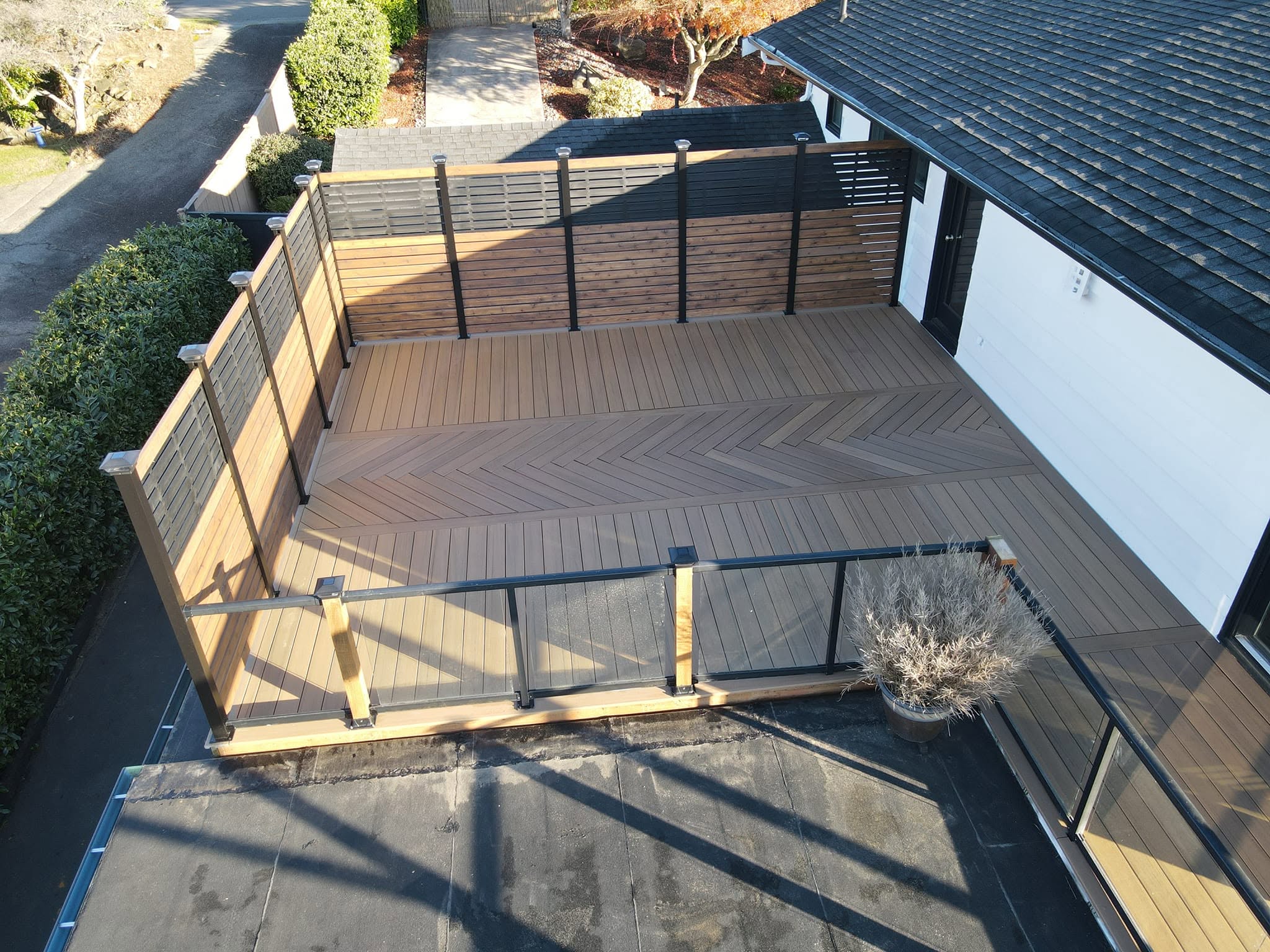 Overhead drone view of deck with chevron centerpiece and diagonal perimeter boards