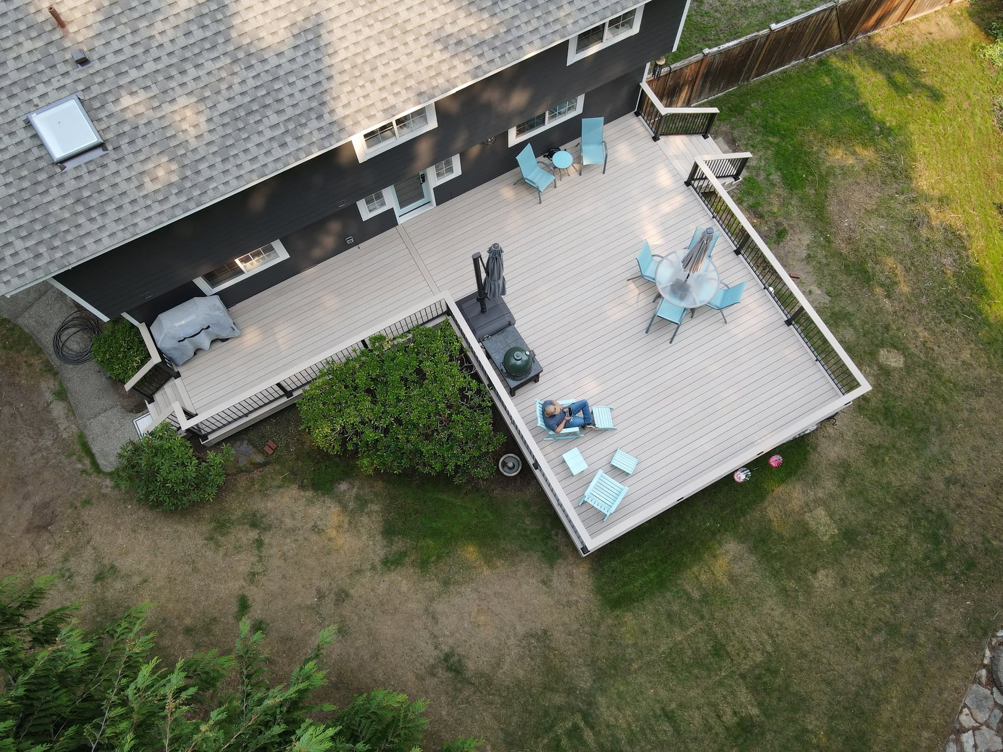 Aerial view of large multi-level composite deck with outdoor furniture